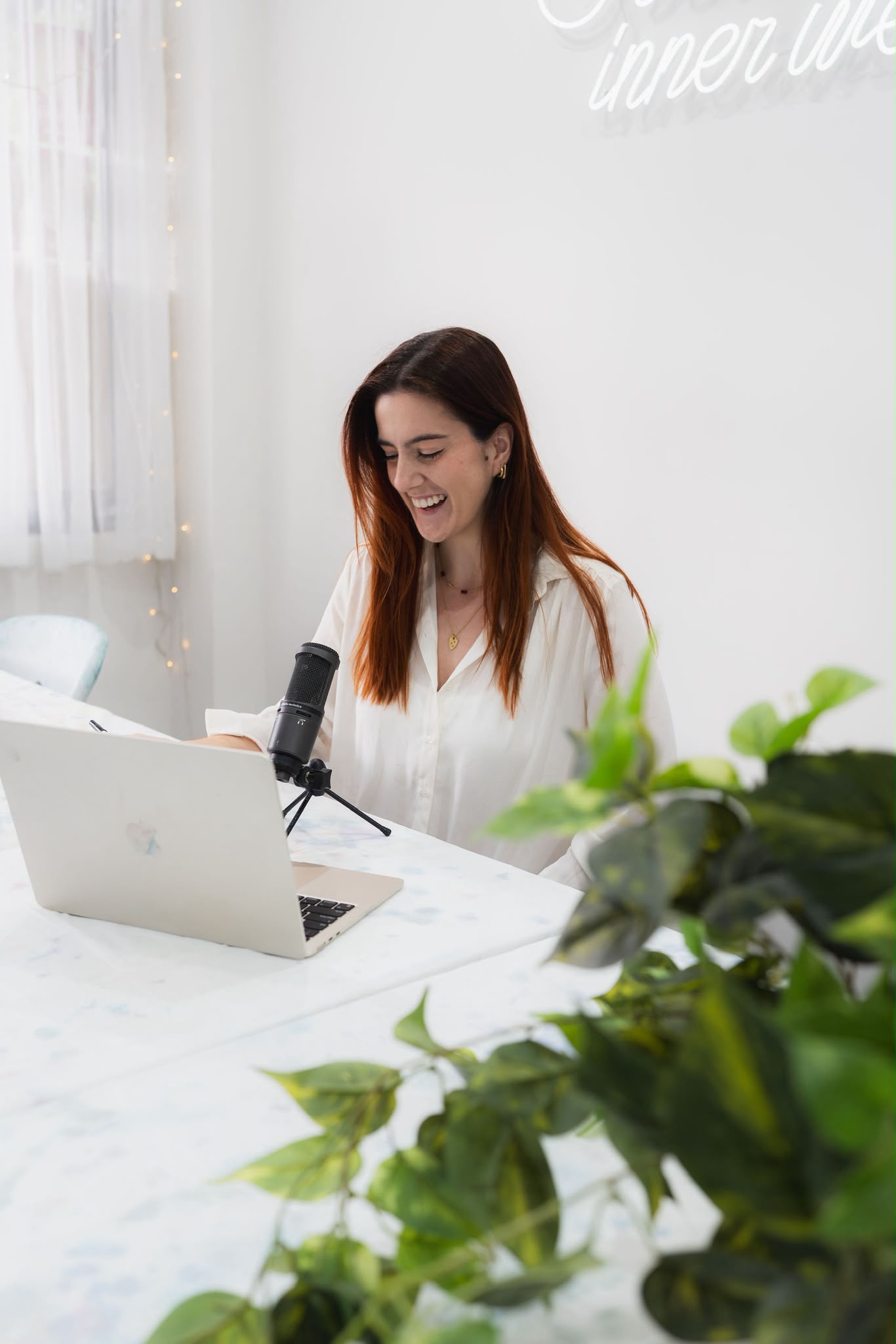 Lucy Dujmovich, founder of The Sellout Workshop Method, recording at her desk
